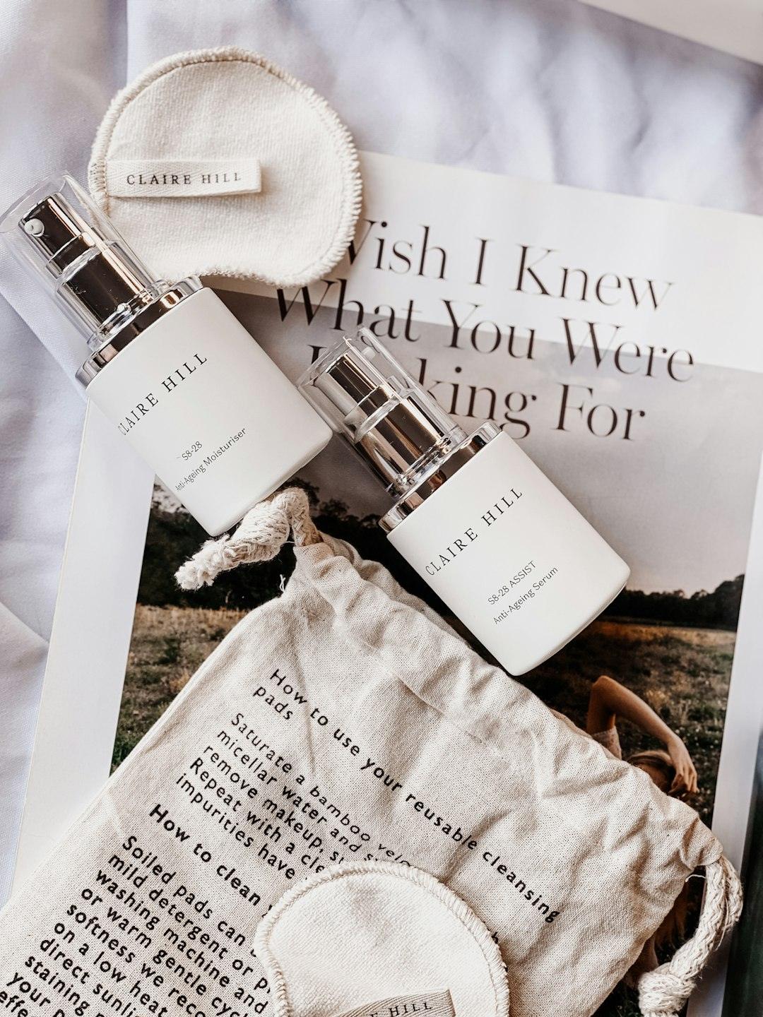 The contents of a bottle of perfume sitting on top of a magazine vc6r ktdxg.jpeg